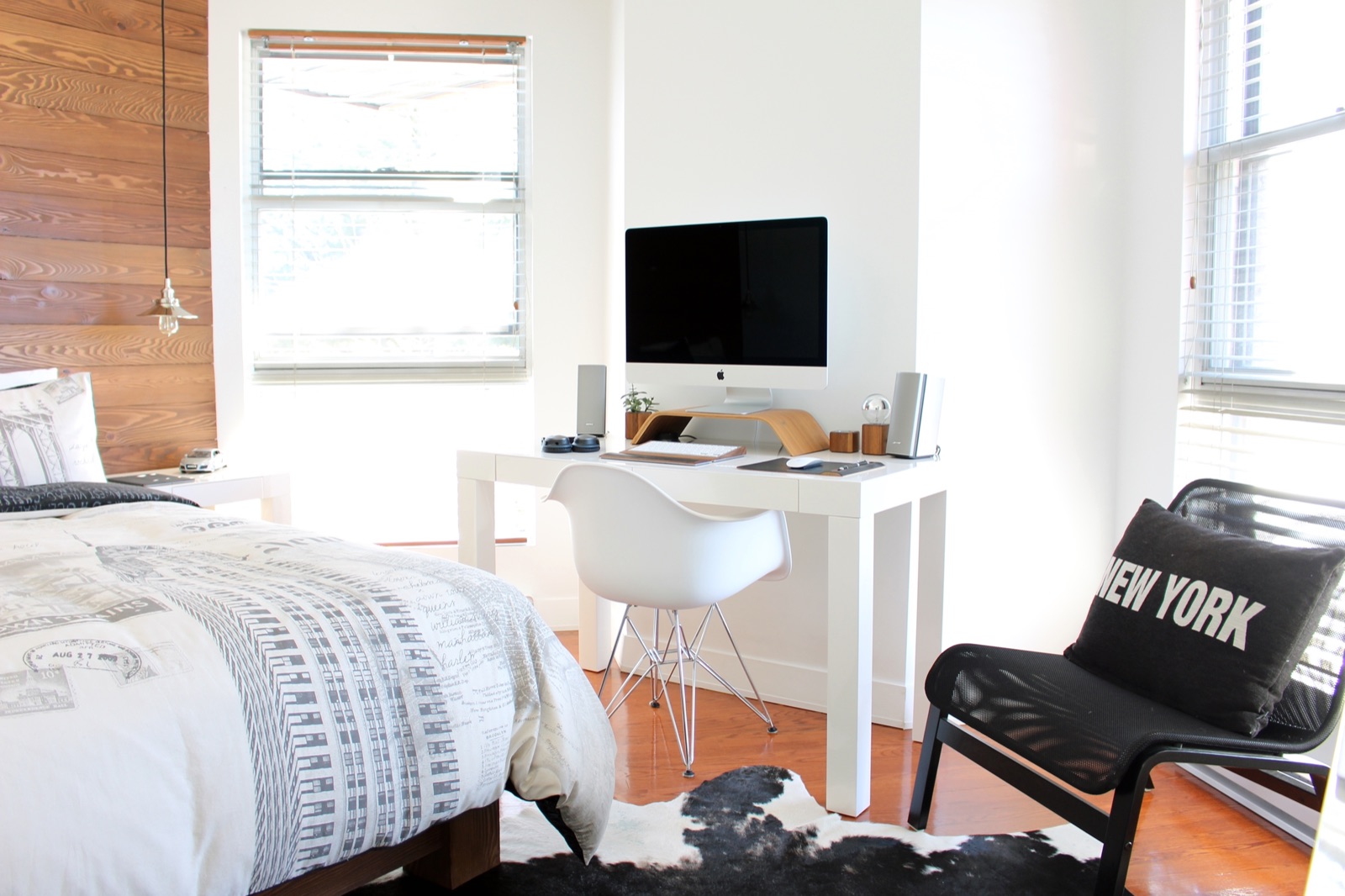 Loft-style bedroom under tall windows
