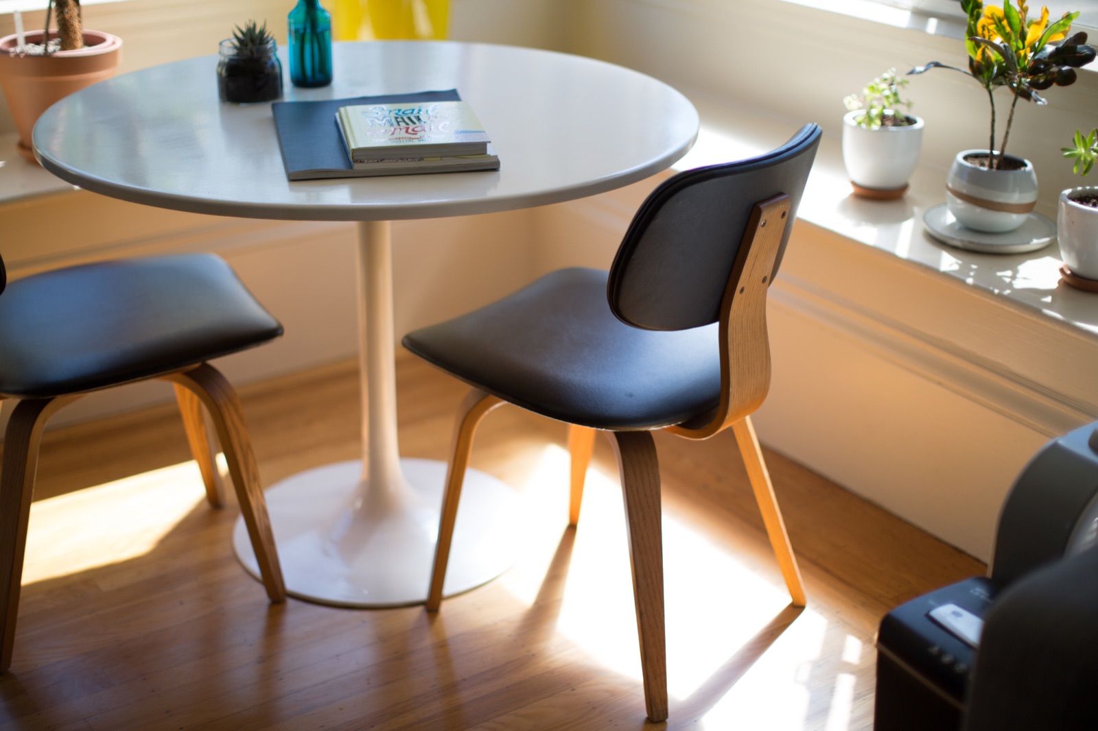 Sunlit dining nook with a round table