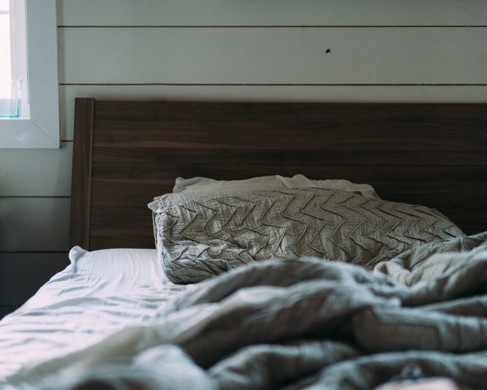 Bedroom with a shiplap wall