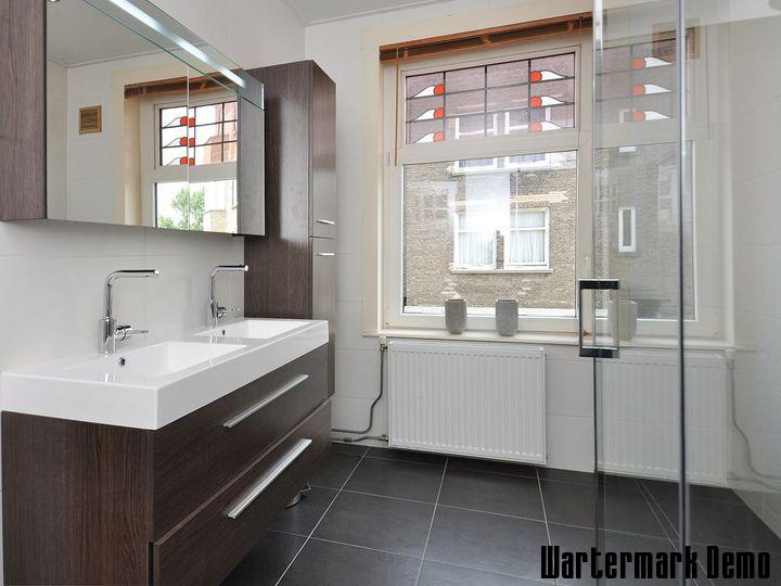 Five-Bedroom Town House on Rue de Rivoli - Bathroom with twin basins on a walnut vanity and a glazed walk-in shower